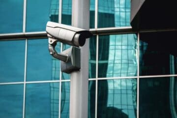 Image of an outdoor security camera attached to a pole.